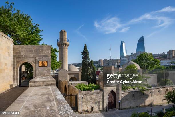the palace of the shirvanshahs and the flame towers in the background , baku, azerbaijan - baku bildbanksfoton och bilder