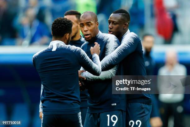 Djibril Sidibe of France and Benjamin Mendy of France gesture prior to the 2018 FIFA World Cup Russia Semi Final match between France and Belgium at...