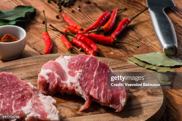 two steak with chili, cayenne powder and other condiment - cayenne powder stock pictures, royalty-free photos & images