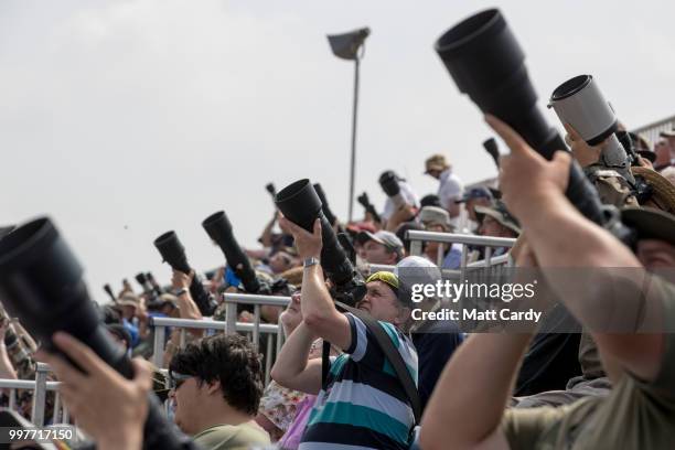 Plane enthusiasts take photographs at the Royal International Air Tattoo at RAF Fairford on July 13, 2018 in Fairford, Gloucestershire, England....