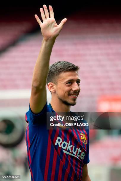 Barcelona's new player French defender Clement Lenglet poses during his official presentation at the Camp Nou stadium in Barcelona on July 13, 2018....