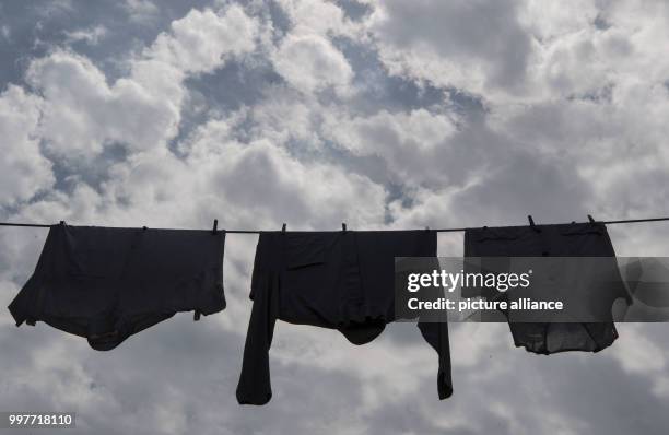 Laundry can be seen as decoration on a clothing line at the adventure park Tripsdrill in Cleebronn, Germany, 31 July 2017. Photo: Marijan Murat/dpa