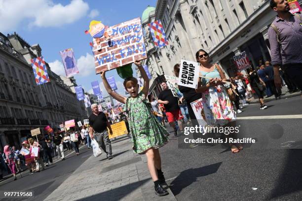 Protesters join a Women's march in central London to demonstrate against President Trump's visit to the UK, on July 13, 2018 in London, England. Tens...