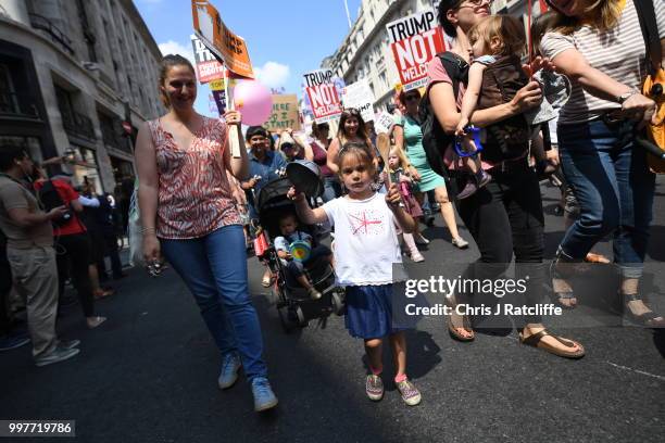 Protesters join a Women's march in central London to demonstrate against President Trump's visit to the UK, on July 13, 2018 in London, England. Tens...