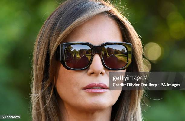 President Donald Trump is reflecting on the First Lady Melania Trump sunglasses as he speaks to the press before departing the White House en route...