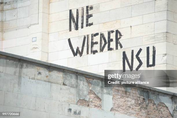 July 2018, Germany, Nuremberg: The words 'NIE WIEDER NSU' on the stone grandstand of the former Nazi party rally grounds. In the trial against the...