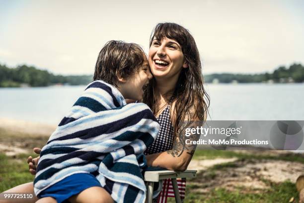 mother drying off her son with towel at lake - 5 loch stock pictures, royalty-free photos & images