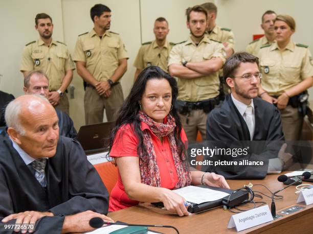 Beate Zschaepe, the principal defendant in the ongoing NSU trial, with her lawyers Hermann Borchert and Mathias Grasel in a courtroom of the Higher...