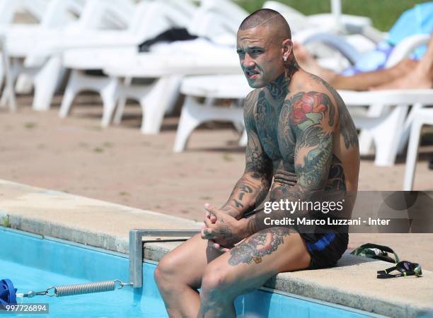 Radja Nainggolan of FC Internazionale sits in the swimming pool during the FC Internazionale training camp at the club's training ground Suning...