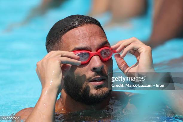 Danilo D Ambrosio of FC Internazionale puts on his goggles in the swimming pool during the FC Internazionale training camp at the club's training...
