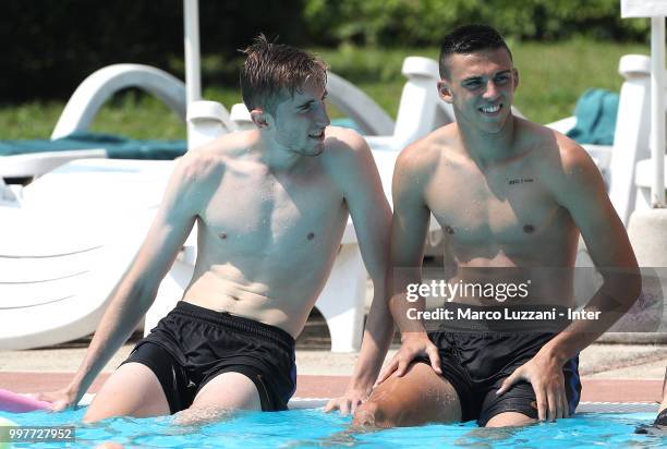 Ryan Patrick Nolan and Gabriele Zappa of FC Internazionale talk in the swimming pool during the FC Internazionale training camp at the club's...
