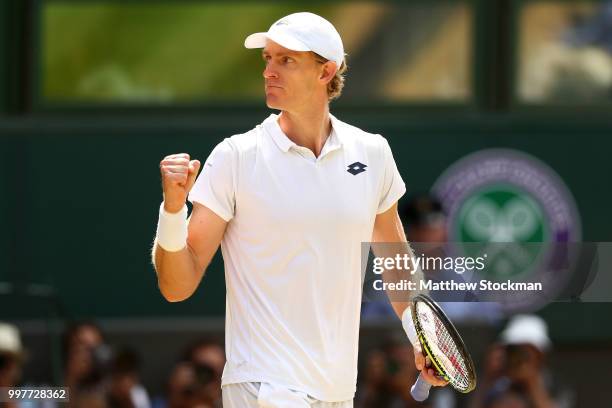 Kevin Anderson of South Africa celebrates winning the first set against John Isner of The United States during their Men's Singles semi-final match...