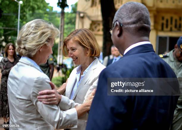 German Defence Ministe Ursula von der Leyen greets her French counterpart Florence Parly while their Malian counterpart, Tiéna Coulibaly, stands on...