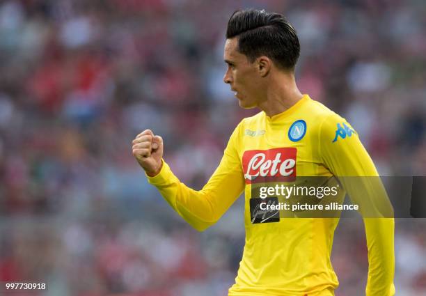 Napoli's Jose Callejon celebrates scoring the opening goal during the Audi Cup semi-final match pitting Atletico Madrid vs SSC Napoli in the Allianz...