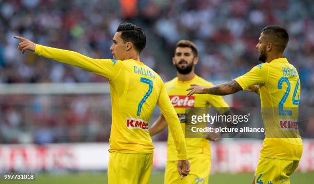 Napoli's Jose Callejon celebrates with Lorenzo Insigne and Alessio Zerbin his scoring the opening goal during the Audi Cup semi-final match pitting...