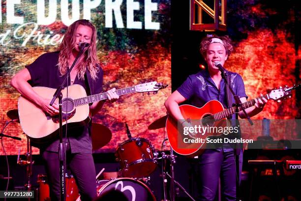 Singers Jimmy James and Forrest Miller perform onstage opening for Robbie Dupree at Bogie's on July 12, 2018 in Westlake Village, California.