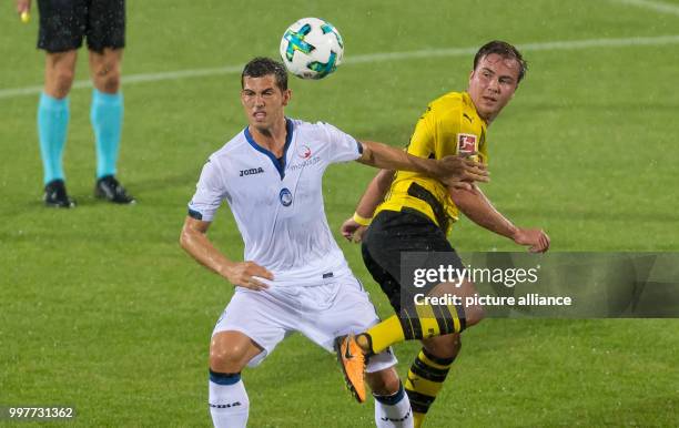 Dortmund's Mario Gotze and Bergamo's Remo Freuler vie for the ball during the Borussia Dortmund vs Atalanta Bergamo test match in Altach, Austria, 01...