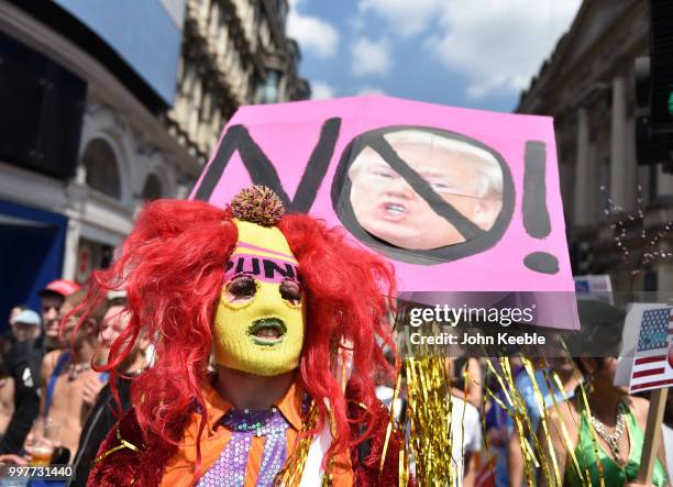 Demonstrators with an anti Trump placards attend the Drag Protest Parade LGBTQi March against Trump on July 13, 2018 in London, United Kingdom. Drag...