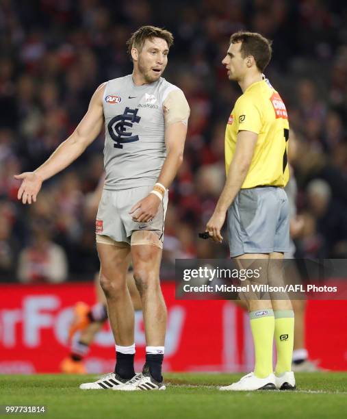 Dale Thomas of the Blues and Umpire Jeff Dalgleish share a discussion during the 2018 AFL round 17 match between the St Kilda Saints and the Carlton...