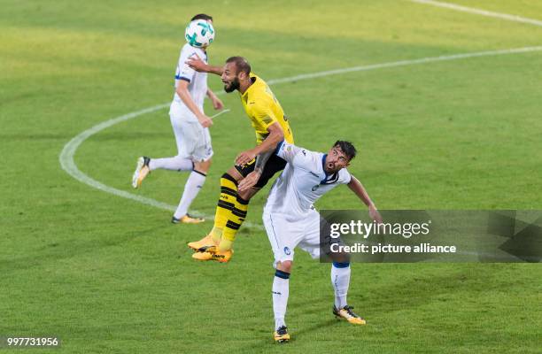 Dortmund's Omer Toprak and Bergamo's Andrea Petagna vie for the ball during the Borussia Dortmund vs Atalanta Bergamo test match in Altach, Austria,...