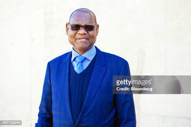 Moses Pelaelo, governor of Bank of Botswana, poses for a photograph during an event to launch commemorative South African rand banknote and coins in...
