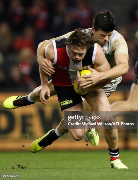 Jack Steven of the Saints is tackled by Matthew Kennedy of the Blues during the 2018 AFL round 17 match between the St Kilda Saints and the Carlton...