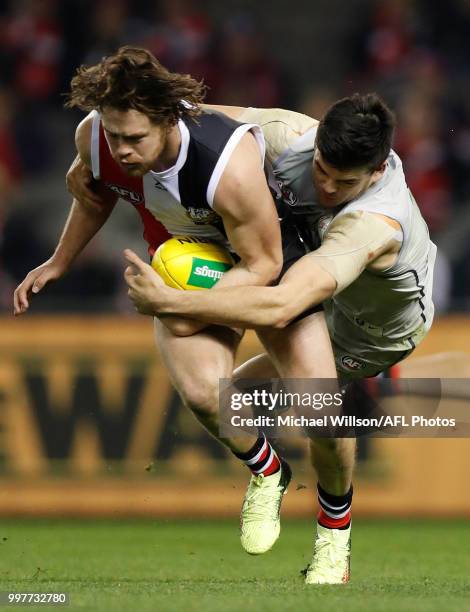 Jack Steven of the Saints is tackled by Matthew Kennedy of the Blues during the 2018 AFL round 17 match between the St Kilda Saints and the Carlton...