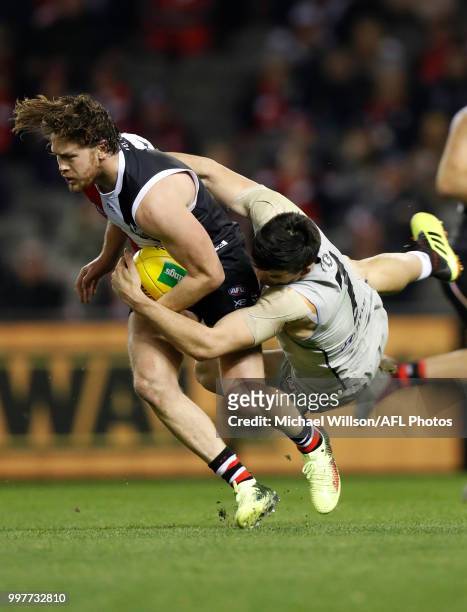 Jack Steven of the Saints is tackled by Matthew Kennedy of the Blues during the 2018 AFL round 17 match between the St Kilda Saints and the Carlton...