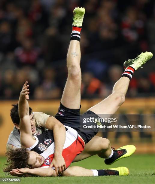 Jack Steven of the Saints is tackled by Matthew Kennedy of the Blues during the 2018 AFL round 17 match between the St Kilda Saints and the Carlton...