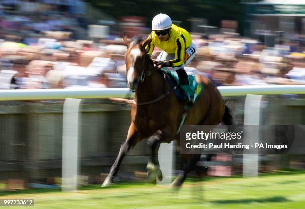 Pretty Pollyanna ridden by Silvestre De Souza wins the Duchess Of Cambridge Stakes during day two of The Moet & Chandon July Festival at Newmarket...