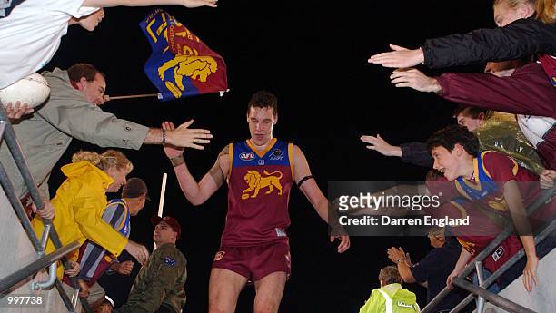 Beau McDonald of Brisbane celebrates winning against Port Adelaide with fans during the AFL Qualifying final match between the Brisbane Lions and the...