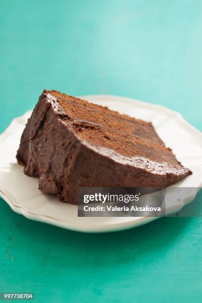 homemade chocolate cake with cream and dark chocolate, closeup, selective focus - white eggplant stock pictures, royalty-free photos & images