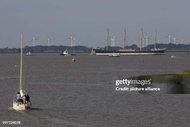 The "Peking" museum ship being towed by two tugs along the Elbe where it meets the Stor river near Wewelsfleth, Germany, 02 August 2017. The...