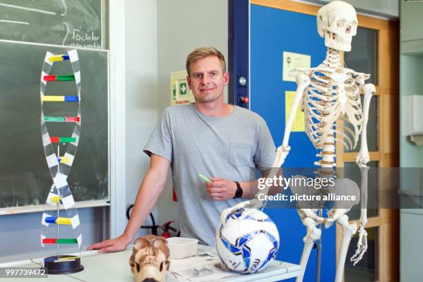 Former professional soccer player Tobias Rau pictured in a classroom of a comprehensive school in Borgholzhausen, Germany, 17 May 2017. The former...