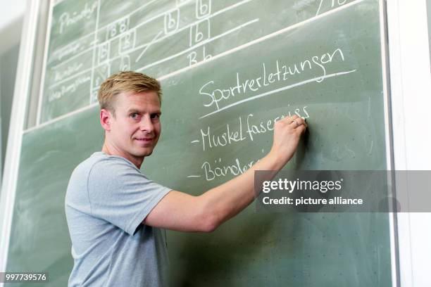 Former professional soccer player Tobias Rau pictured in a classroom of a comprehensive school in Borgholzhausen, Germany, 17 May 2017. The former...