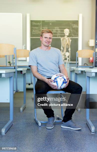 Former professional soccer player Tobias Rau pictured in a classroom of a comprehensive school in Borgholzhausen, Germany, 17 May 2017. The former...