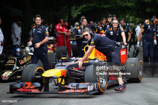 The Red Bull Racing team prepare the RB8 for a run during the Goodwood Festival of Speed at Goodwood on July 13, 2018 in Chichester, England.