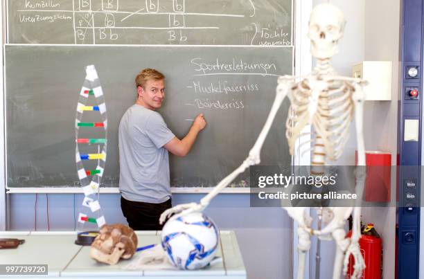 Former professional soccer player Tobias Rau pictured in a classroom of a comprehensive school in Borgholzhausen, Germany, 17 May 2017. The former...