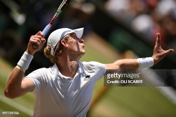 South Africa's Kevin Anderson serves against US player John Isner during their men's singles semi-final match on the eleventh day of the 2018...