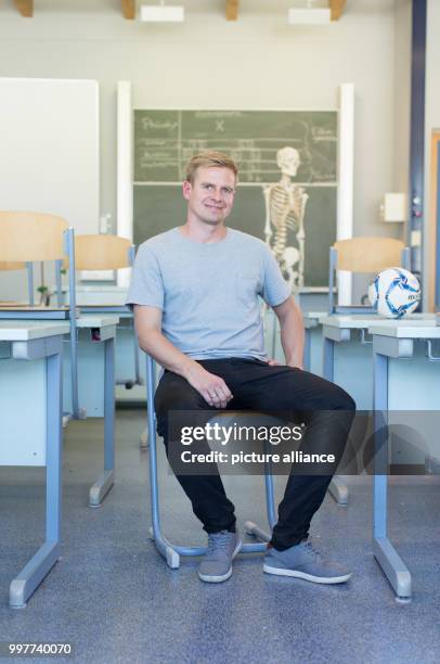 Former professional soccer player Tobias Rau pictured in a classroom of a comprehensive school in Borgholzhausen, Germany, 17 May 2017. The former...