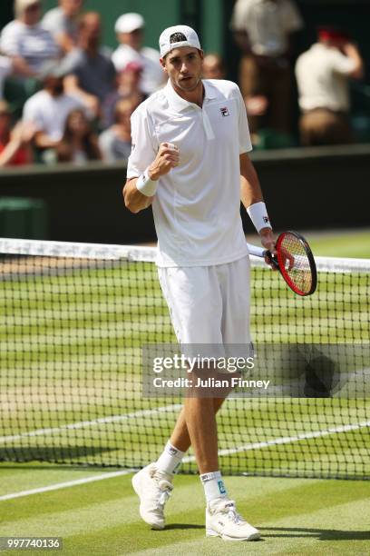 John Isner of The United States celebrates a point against Kevin Anderson of South Africa during their Men's Singles semi-final match on day eleven...