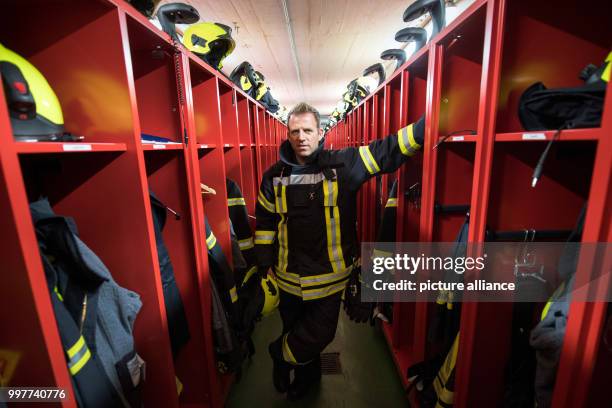 Picture of former professional soccer player and currently firefighter Christian Mikolajczak taken in a fire station in Oberhausen, Germany, 04 May...