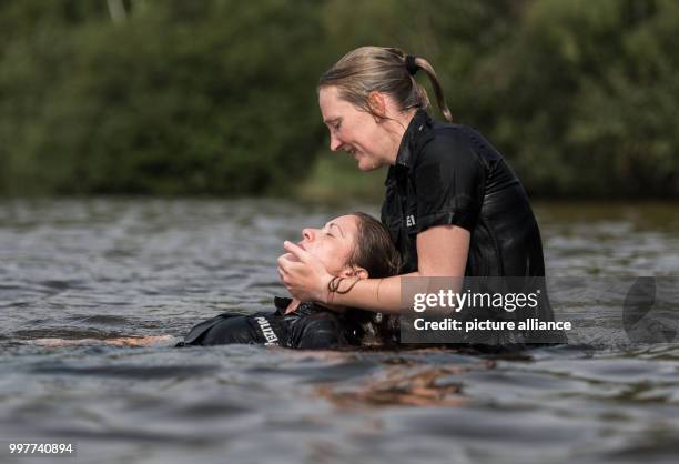 Police Officer Rescuing 3,596 Testing The Water Stock Photos, High-Res Pictures, and Images ...