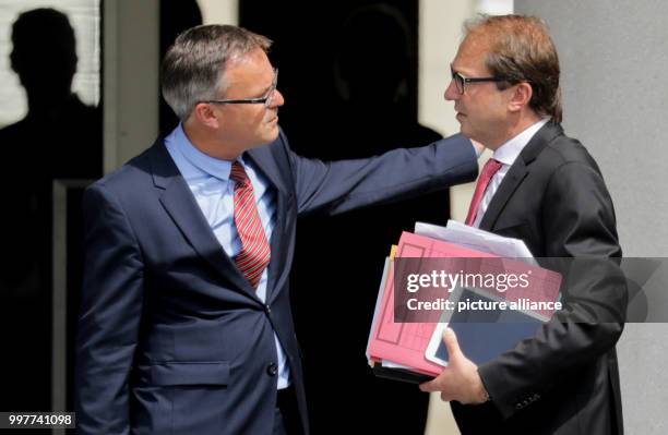 German Transport Minister Alexander Dobrindt being received in front of the Federal Ministry of the Interior by an employee of the Ministry in...