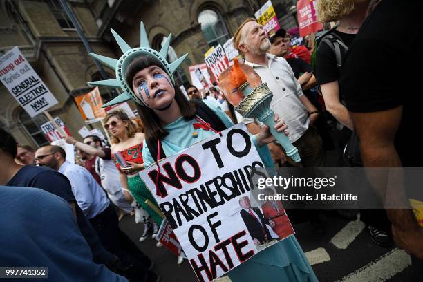 Protester takes part in a demonstration against President Trump's visit to the UK near Portland Place on July 13, 2018 in London, England. Tens of...
