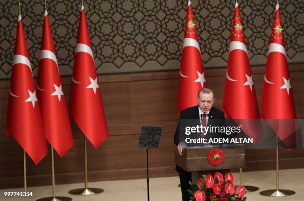 Turkey's President Recep Tayyip Erdogan makes a speech during an investiture ceremony where Turkish Grand National Assembly Speaker Binali Yildirim...