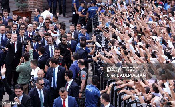 Turkey's President Recep Tayyip Erdogan , Turkish Grand National Assembly Speaker Binali Yildirim and members of the Presidential Cabinet greet the...