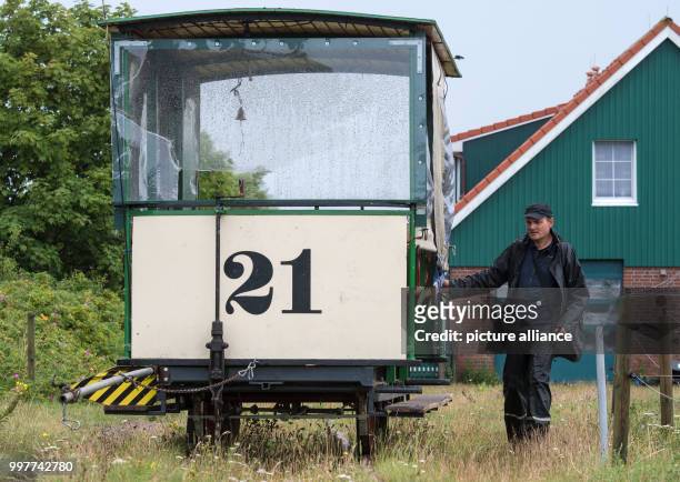 Christian Roll, the manager of the horse train, puts a wagon in position using a track switch in front of the platform for the defunct railway on the...
