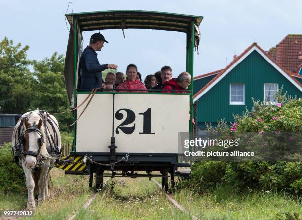 Christian Roll , the manager of the horse train, tells his passengers about the history of the defunct railway on the the Baltic Sea island of...