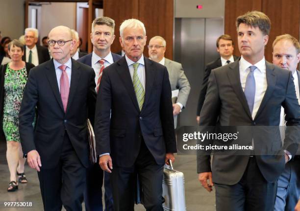 Volkswagen's chief lobbyist Thomas Steg, chairman of the board of Volkswagen Matthias Mueller and chairman of the board at BMW Harald Krueger leave...